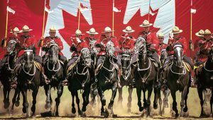 One Fell Swoop - Canadian Mounties charging on horseback