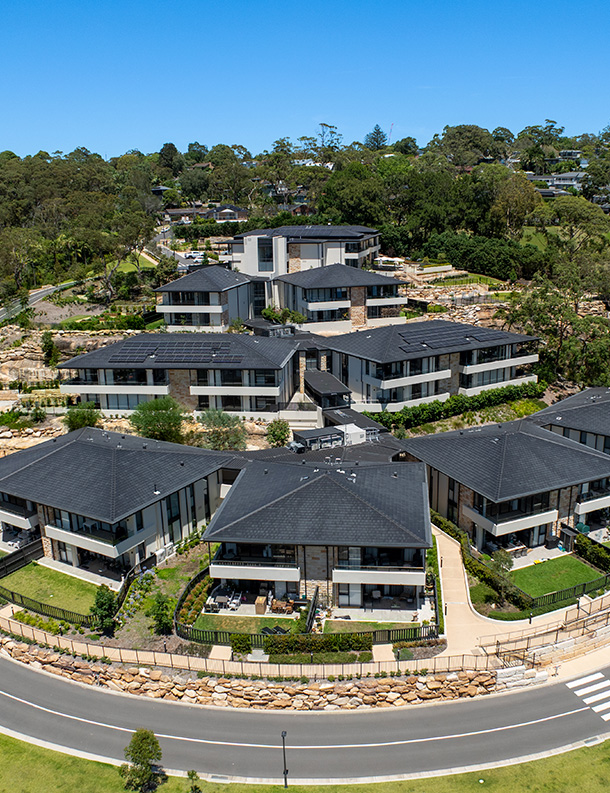 One Fell Swoop - image of gardens and exterior buildings at The Falls Estate