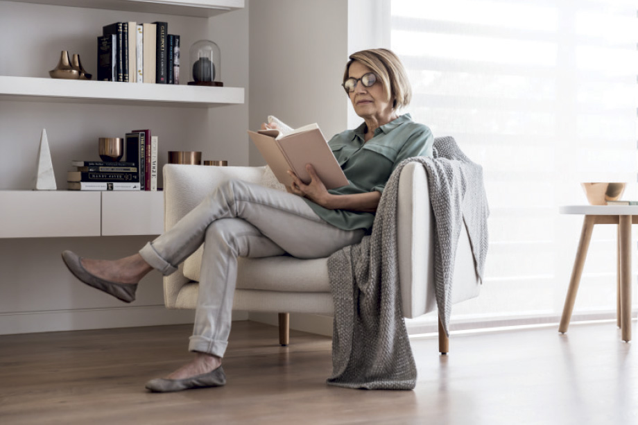 One Fell Swoop - Case Study - Pavilions Blackburn Lake - Guest reading book in apartment
