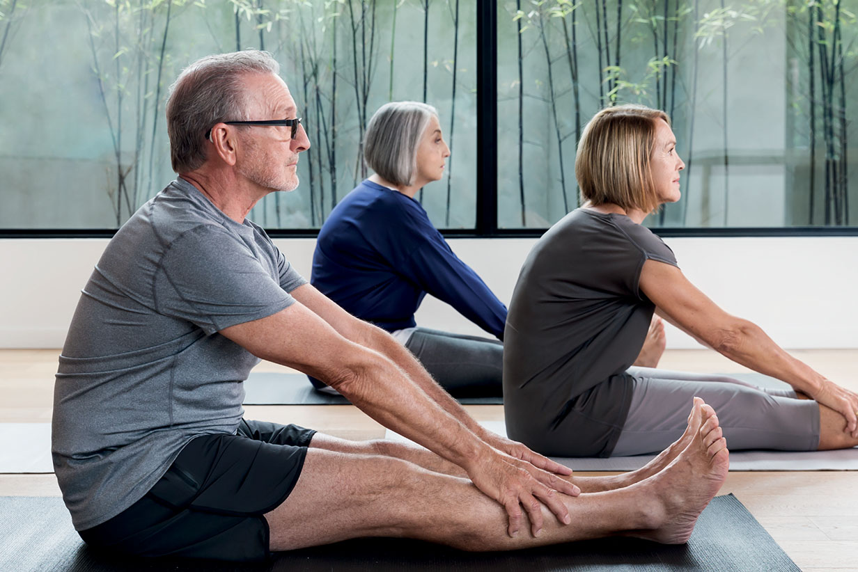 One Fell Swoop - senior people on yoga mat