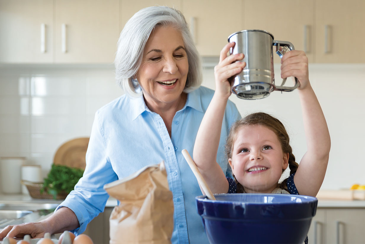 One Fell Swoop - senior woman and girl baking