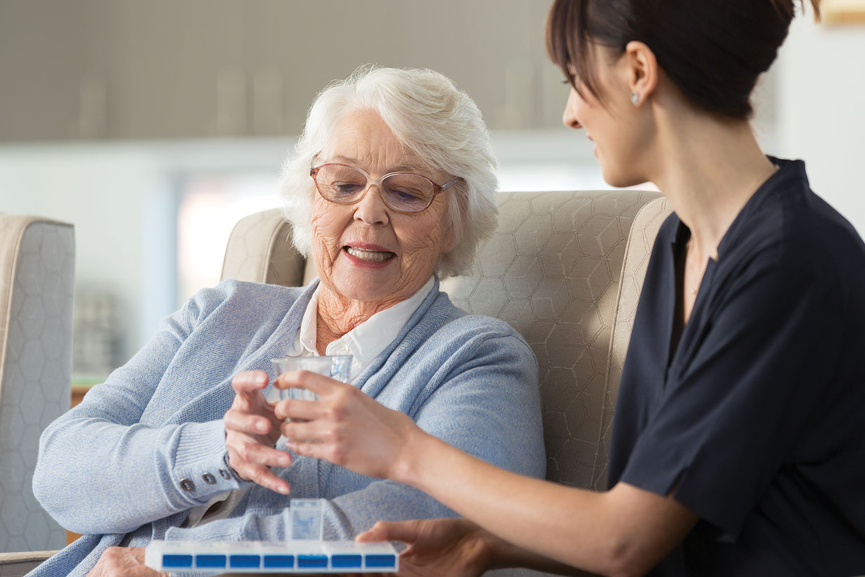 One Fell Swoop - senior woman taking medication