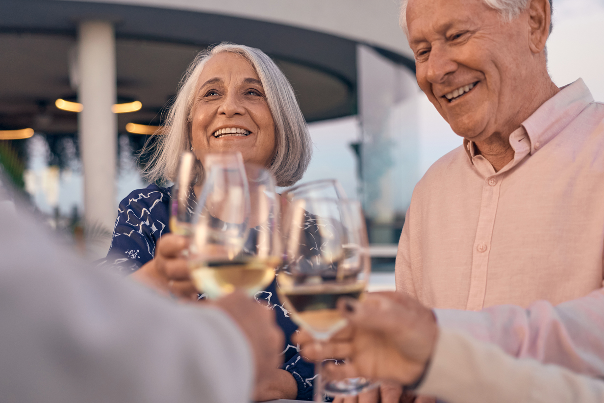 One Fell Swoop - couple toasting with friends
