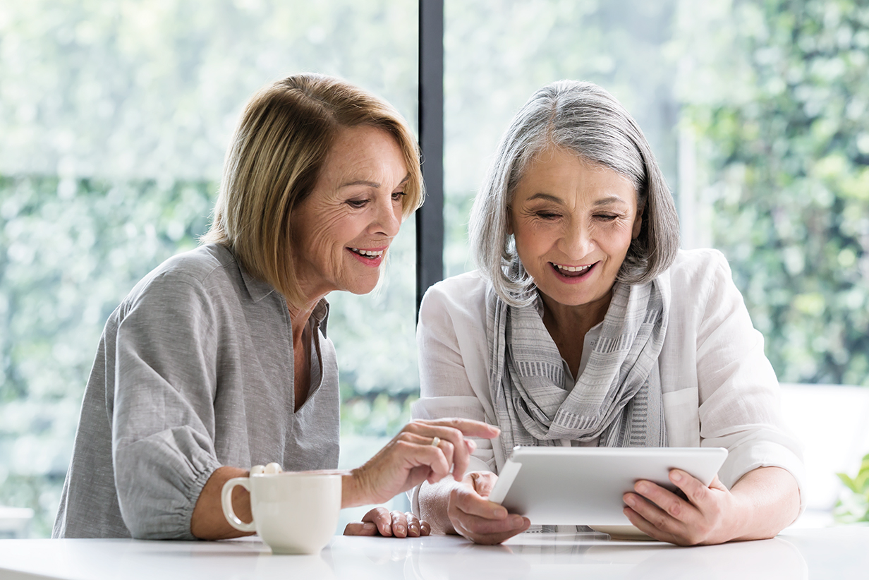 One Fell Swoop - two woman using tablet