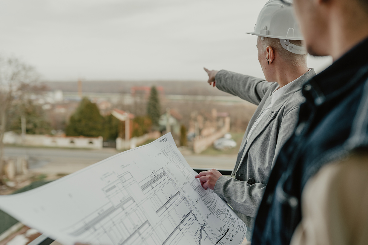 One Fell Swoop - builders looking over a construction site