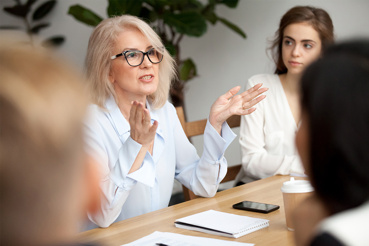 One Fell Swoop - woman talking during a meeting