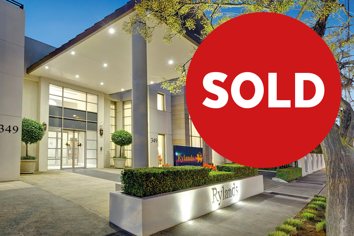 One Fell Swoop - image of a retirement community with a Sold sticker at right