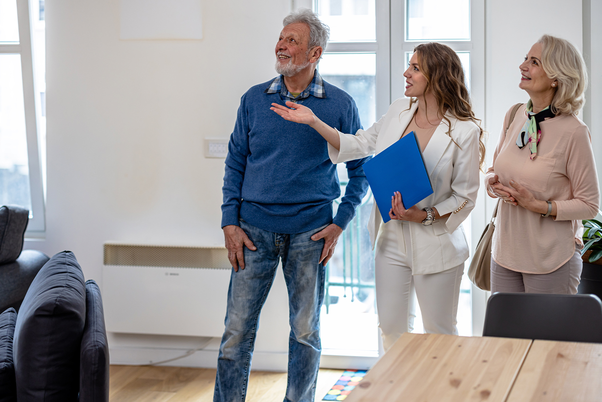 One Fell Swoop - Sales Manager showing senior couple around a display apartment